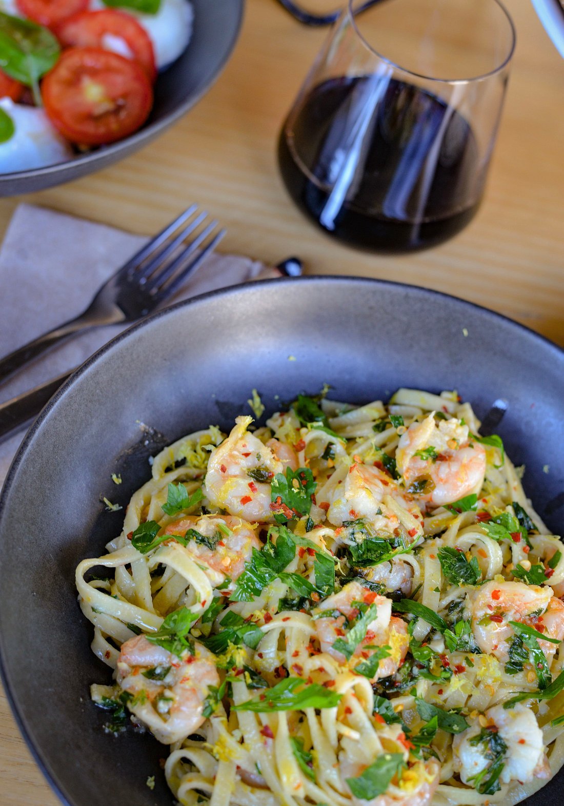 Prawn pasta with wine glass at Pizza:deli
