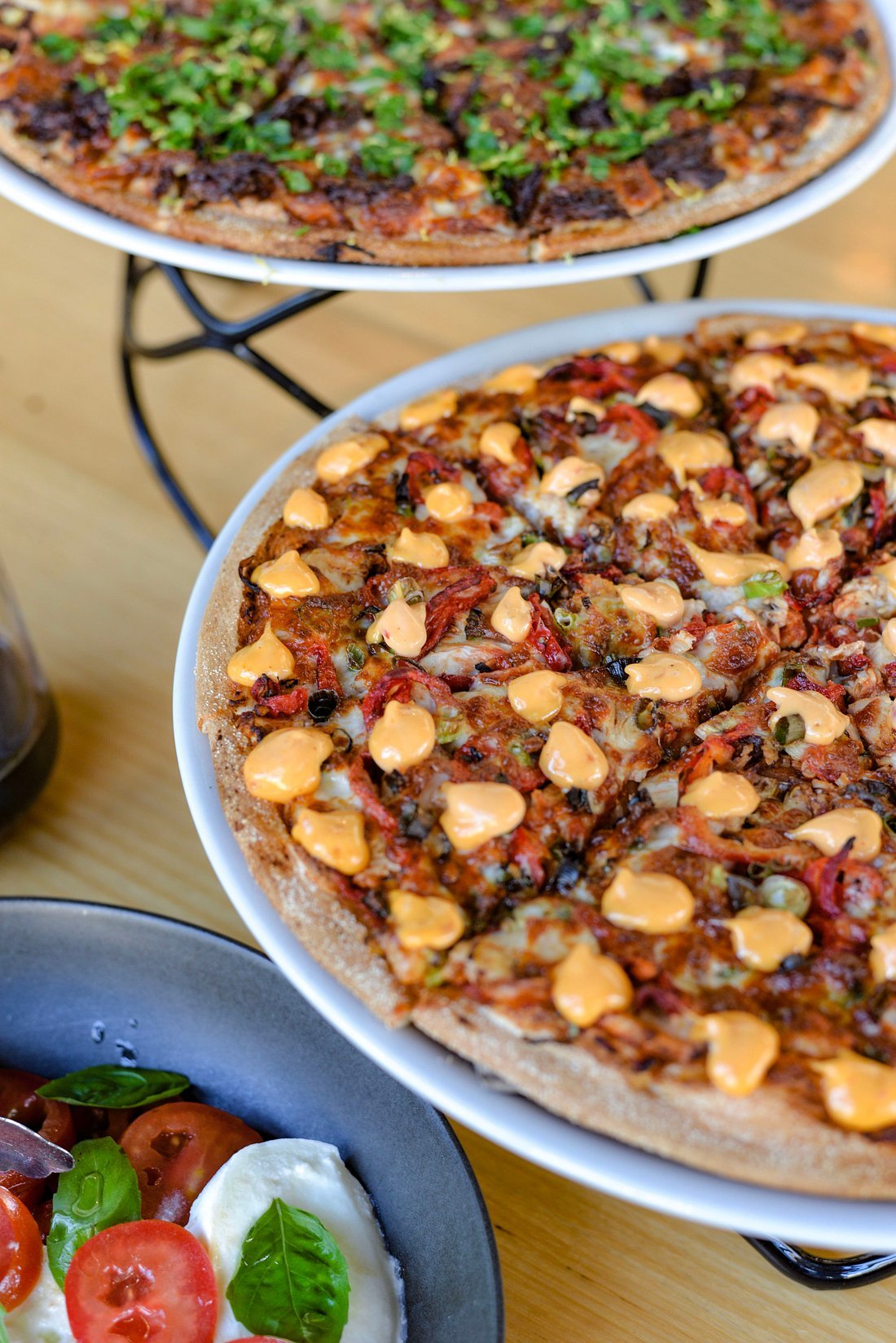 A spread of gourmet pizzas at Pizza:deli